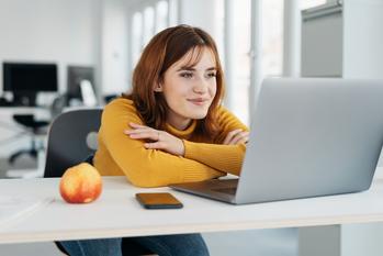 3 Expert Tips to Pay Off Your Student Loans Within the Decade: https://g.foolcdn.com/editorial/images/739849/woman-20s-yellow-shirt-laptop-smiling-gettyimages-1224413248.jpg