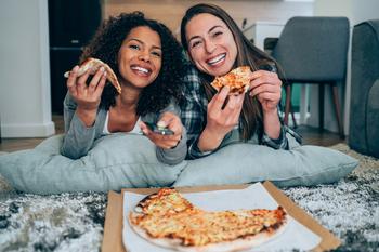 This Dividend Stock Rarely Goes on Sale. Here Are 3 Reasons to Get It While It's Hot.: https://g.foolcdn.com/editorial/images/733183/eating-pizza-and-watching-tv-together.jpg