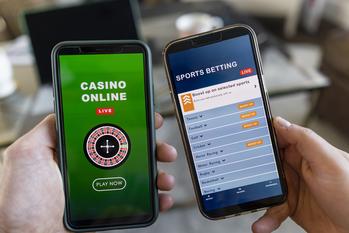 Why Gambling.com Group Stock Rose 20% This Week: https://g.foolcdn.com/editorial/images/744562/two-hands-holding-phones-open-to-gambling-sites.jpg