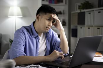 No Idea How to Invest for Your Retirement? Here's a Good Strategy to Employ.: https://g.foolcdn.com/editorial/images/753283/man-20s-laptop-stressed-holding-head-gettyimages-1368701558.jpg
