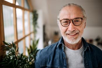 The Best Reason to Take Social Security Long Before Age 70: https://g.foolcdn.com/editorial/images/688975/smiling-man-glasses.jpg
