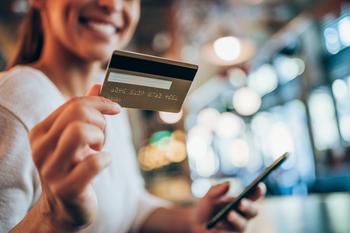 Why Visa Stock Stumbled Today: https://g.foolcdn.com/editorial/images/741353/person-smiling-while-holding-a-payment-card-and-smartphone.jpg