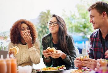2 Fast-Food Stocks to Buy Right Now: https://g.foolcdn.com/editorial/images/730530/three-friends-eating-burgers-outdoors.jpg
