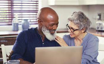 These 2 Changes Will Give the Average Retiree an Extra $1,826 in 2023: https://g.foolcdn.com/editorial/images/705712/smiling-mature-couple-using-laptop-at-home.jpg