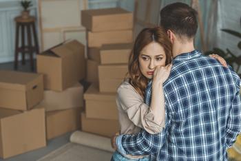 Why Redfin Stock Was Plummeting This Week: https://g.foolcdn.com/editorial/images/773495/person-looking-sad-while-hugging-partner-in-room-full-of-moving-boxes.jpg