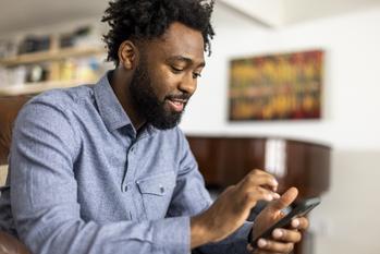3 Unstoppable Stocks You Can Buy Now for Less Than $100: https://g.foolcdn.com/editorial/images/704070/african-american-man-holding-a-smartphone.jpg