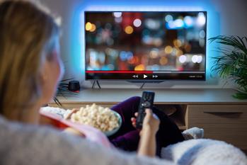 Why Streaming Won't Always Be a Loss for Amazon: https://g.foolcdn.com/editorial/images/688891/woman-streaming-on-tv-with-popcorn.jpg