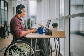 Is Trade Desk Stock a Buy Today While It's Down 33% YTD?: https://g.foolcdn.com/editorial/images/699598/man-in-wheelchair-sitting-at-desk-on-computer.jpg