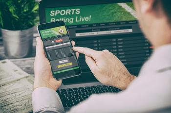 Will DraftKings Ever Make Money?: https://g.foolcdn.com/editorial/images/731619/person-betting-on-sports-online.jpg