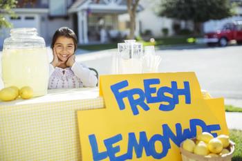Why Lemonade Stock Soured in August: https://g.foolcdn.com/editorial/images/746824/portrait-of-smiling-child-at-lemonade-stand.jpg