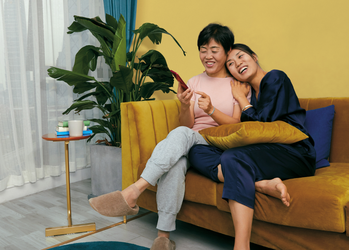 Alibaba Stock Is Up 87%. Time to Sell?: https://g.foolcdn.com/editorial/images/833751/smiling-people-on-couch-shop-online-in-china-source-pinduoduo.png
