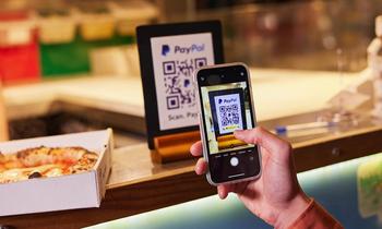 Where Will PayPal Be in 3 Years?: https://g.foolcdn.com/editorial/images/765756/person-at-counter-ordering-food-with-phone-by-scanning-paypal-qr-code_paypal.jpg