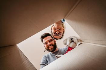 This High-Yield Stock Is Winning as Home Affordability Moves Further Out of Reach: https://g.foolcdn.com/editorial/images/750452/21_12_10-two-people-looking-into-a-box-with-their-dog-_gettyimages-1316497909.jpg
