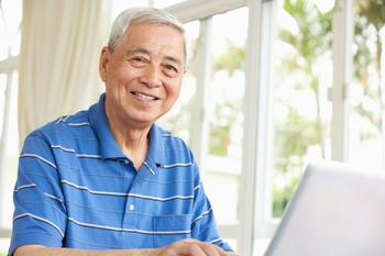 3 Stocks to Buy if They Take a Dip: https://g.foolcdn.com/editorial/images/755899/getty-older-man-smiling-laptop.jpg