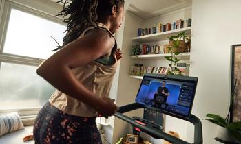 Where Will Peloton Stock Be in 5 Years?: https://g.foolcdn.com/editorial/images/772123/person-using-peloton-treadmill-while-peloton-instructor-is-in-view-on-screen_peloton.jpg