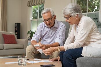 Are Retirees on Track for a Pleasant Surprise When It Comes to Their 2025 Cost-of-Living Adjustment? The Answer May Not Be What You Think: https://g.foolcdn.com/editorial/images/775940/retired-couple-looking-at-financial-paperwork.jpg
