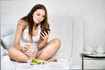 1 Analyst Thinks Apple Stock Will Slide to $162. Is It a Sell?: https://g.foolcdn.com/editorial/images/773048/person-in-undershirt-using-a-smartphone-in-bed.jpg