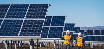 Is NextEra Energy a Millionaire-Maker?: https://g.foolcdn.com/editorial/images/765218/engineers-walk-beside-rows-of-solar-panels.jpg