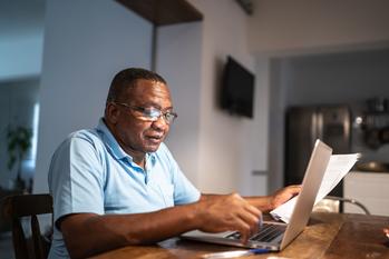 Late Medicare Enrollees Face Steep Penalties. If a New Bill Passes, That Could Change.: https://g.foolcdn.com/editorial/images/703381/older-man-at-laptop-gettyimages-1291418397.jpg