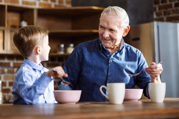 This Value Stock is Splitting Into 3 Companies. What's Next for Income Investors?: https://g.foolcdn.com/editorial/images/686121/grandparent-enjoys-breakfast-cereal-with-grandchild-in-kitchen.jpg