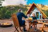 Will My Social Security Benefit Change if I Move to Another State?: https://g.foolcdn.com/editorial/images/776065/couple-toasting-over-table-outside-house.jpg