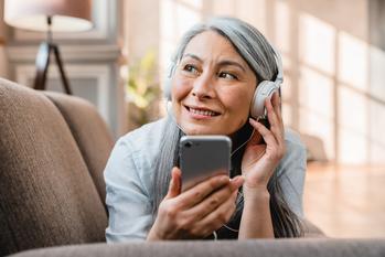 Over 50? 3 Roth IRA Benefits You Can Enjoy in 2024: https://g.foolcdn.com/editorial/images/728156/listening-to-phone-podcast-music.jpg