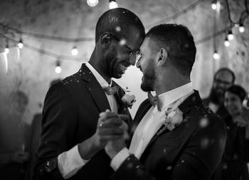 Getting Married in 2023? 7 Major Financial Benefits You're About to Reap: https://g.foolcdn.com/editorial/images/739737/getty-smiling-couple-getting-married-wedding-black-and-white-lgbt-gay.jpg