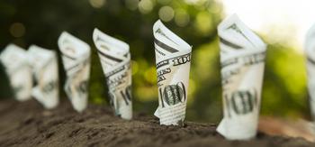 These 3 Dividend ETFs Are a Retiree's Best Friend: https://g.foolcdn.com/editorial/images/772409/23_11_08-a-line-of-100-dollar-bills-planted-in-the-ground-_mf-dloadgetty-dividend-stocks-growing-money-income-cash.jpg