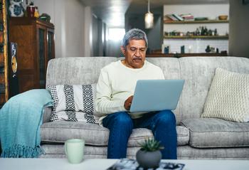 22% of Americans Are Likely to Retire in 2024. Before You Do, Make These Moves: https://g.foolcdn.com/editorial/images/758824/senior-man-a-person-using-a-laptop-on-a-couch_gettyimages-1357522262.jpg