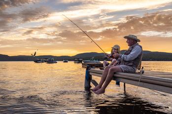 Why Johnson Outdoors Stock Was Jumping Today: https://g.foolcdn.com/editorial/images/712507/grandfather-and-grandson-fishing-at-sunset.jpg