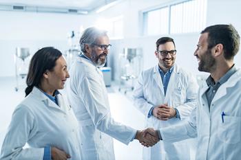 Why Madrigal Pharmaceuticals Stock Is Crushing It Today: https://g.foolcdn.com/editorial/images/713544/scientists-smiling-and-shaking-hands.jpg