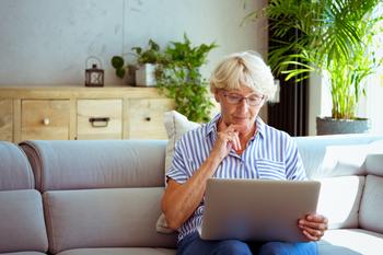 There's 1 Month Left of Medicare Open Enrollment. Make the Most of It By Doing These Things: https://g.foolcdn.com/editorial/images/753292/senior-woman-holding-laptop-gettyimages-1278976690.jpg