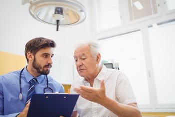 Are Your Medicare Costs Actually Decreasing in 2023?: https://g.foolcdn.com/editorial/images/706084/senior-man-talking-to-doctor-holding-clipboard-medical-expenses-healthcare-hospital.jpg