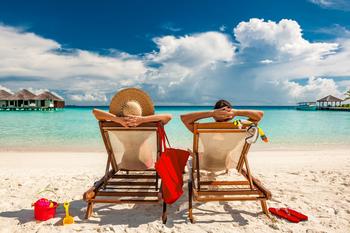 Carnival Cruise Lines: Buy, Sell, or Hold?: https://g.foolcdn.com/editorial/images/737311/gettyman-and-woman-relaxing-in-lounge-chairs-on-a-beach-in-the-maldives.jpg