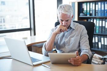 6 in 10 Americans Are More Worried About Running Out of Money in Retirement Than Dying: https://g.foolcdn.com/editorial/images/735836/older-man-desk-tablet-serious-gettyimages-536316477.jpg