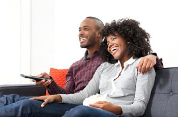 3 Green Flags for Roku's Future: https://g.foolcdn.com/editorial/images/739595/couple-tv-couch.jpg