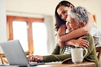 My Top 4 Dividend Stocks to Buy Now: https://g.foolcdn.com/editorial/images/689591/younger-person-hugging-older-person-while-they-look-at-a-laptop.jpg