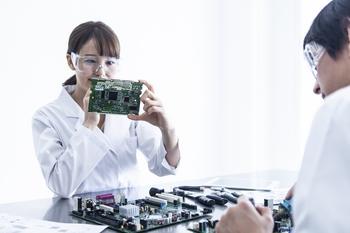 Is Broadcom Stock a Buy Now?: https://g.foolcdn.com/editorial/images/768995/woman-in-specs-holding-an-integrated-circuit.jpg