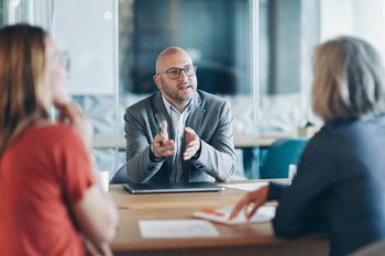 Prediction: The Next Microsoft-Level Stock Could Come From an Unexpected AI Niche: https://g.foolcdn.com/editorial/images/837987/professional_talking_to_colleagues_in_a_office_meeting.jpg