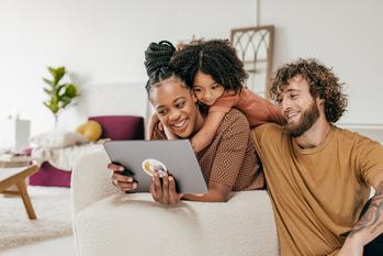 Why Alphabet, The Trade Desk, and Roku Fell Today: https://g.foolcdn.com/editorial/images/714437/smiling-parents-and-daughter-at-home-watching-online-movie-together.jpg