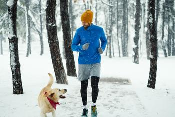 Why Chewy Stock Was Down on Tuesday: https://g.foolcdn.com/editorial/images/714464/man-with-his-dog-jogging-on-winter-day.jpg