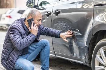 Why Progressive Stock Is an Incredible Bargain Right Now: https://g.foolcdn.com/editorial/images/840147/person-on-phone-looks-at-damaged-car-getty.jpg