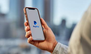 Is PayPal Stock a Buy?: https://g.foolcdn.com/editorial/images/771908/person-holding-phone-with-paypal-app-1_paypal.jpg