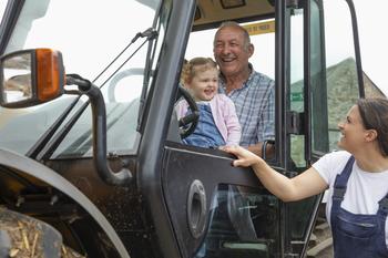 3 Ingredients That Make Up Deere's Secret Sauce for Growth: https://g.foolcdn.com/editorial/images/697429/a-family-smiles-while-riding-in-the-cab-of-a-tractor.jpg