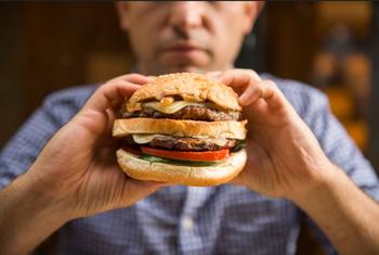 Forget Chipotle's Stock Split: Buy This Monster Restaurant Growth Stock Instead: https://g.foolcdn.com/editorial/images/775363/hamburger-guy-eating.jpg