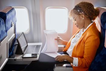 2 Stocks Down 33% and 52% to Buy Right Now: https://g.foolcdn.com/editorial/images/740469/businesswoman-reading-documents-and-working-on-digital-tablet-during-flight.jpg