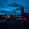 Eni Aktie: Strategie-Update nahtPhoto, wide shot, wide-angle lens,  Coal company, Blue hour, twilight, cool, ISO1200, slow shutter speed, photo by David Maisel: https://img.midjourneyapi.xyz/temp/2a011bdc-adca-4de9-8457-d868b31178cf.png