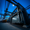 AT&T Aktie: InfrastrukturschubPhoto, wide shot, wide-angle lens, Metal fabrication, Blue hour, twilight, cool, ISO1200, slow shutter speed, photo by Hiroshi Sugimoto: https://img.midjourneyapi.xyz/temp/568784d0-c41a-4663-ab01-91f29a370903.png