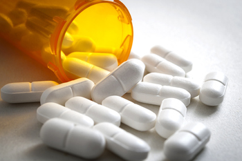 Why Merck Is Sinking This Week: https://g.foolcdn.com/editorial/images/839100/open-pill-bottle-spilling-out.jpg