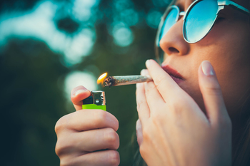 Why Investors Were High on Trulieve Cannabis Stock Today: https://g.foolcdn.com/editorial/images/841587/person-lighting-and-consuming-a-marijuana-cigarette.jpg